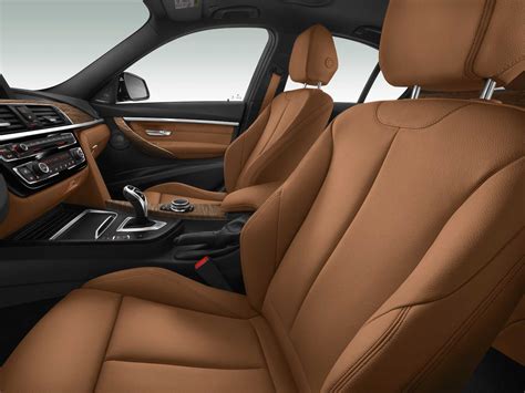 The multi-tone stitching and piping adds visual interest. . Cognac bmw interior